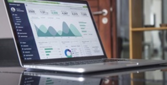 a desktop computer showing a graph