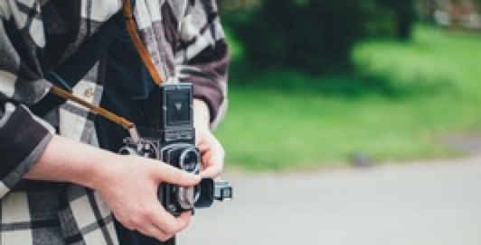 a man watching a digital pro camera
